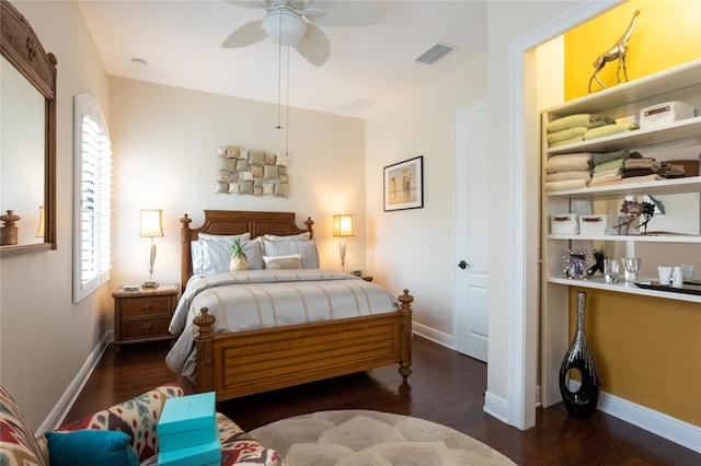 bedroom with dark wood-type flooring and ceiling fan
