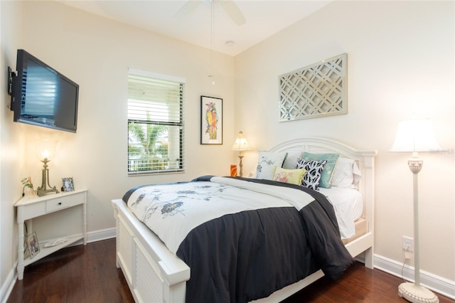 bedroom featuring dark hardwood / wood-style floors and ceiling fan