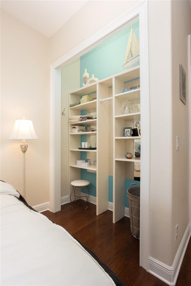 bedroom featuring dark hardwood / wood-style flooring