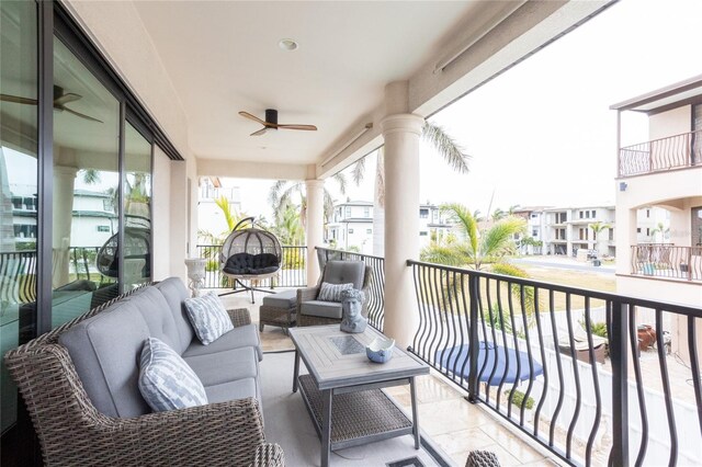 balcony featuring outdoor lounge area and ceiling fan