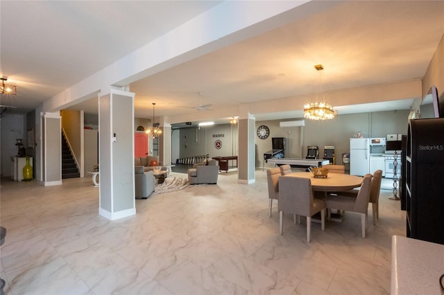 dining area with a notable chandelier and a wall mounted AC