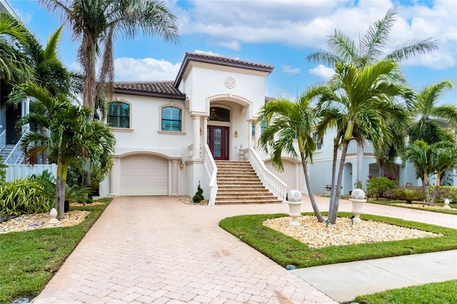 mediterranean / spanish-style home featuring a garage