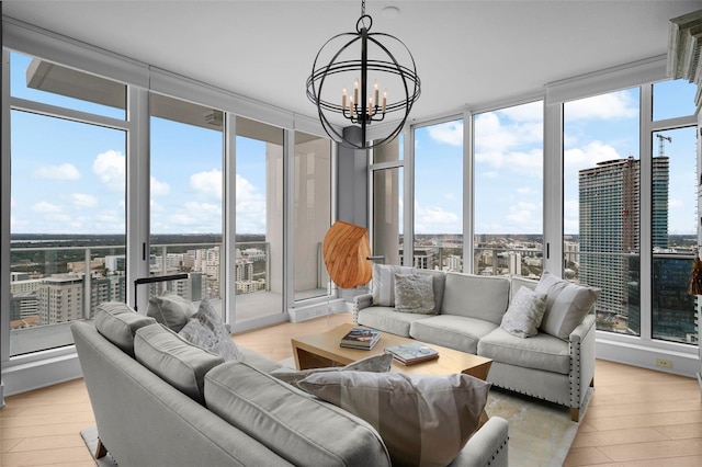 sunroom featuring a chandelier