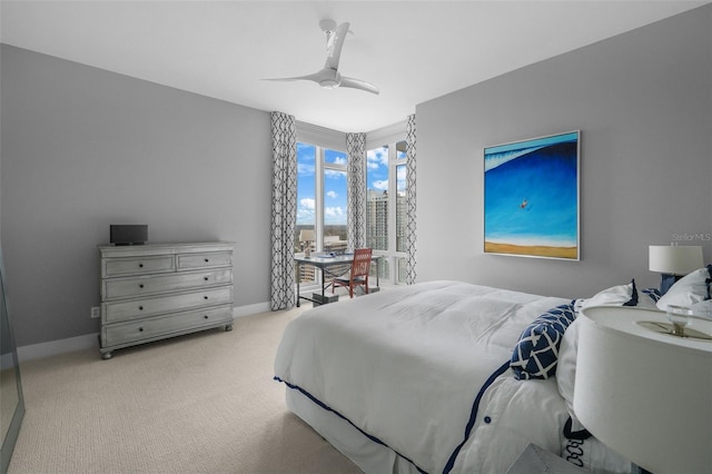 bedroom featuring ceiling fan and light carpet