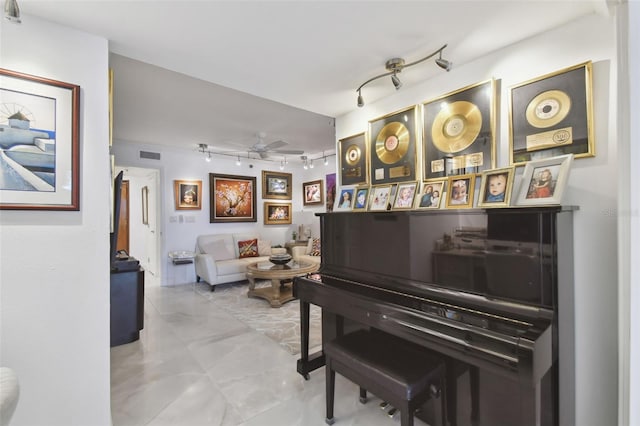 sitting room with rail lighting, visible vents, and ceiling fan