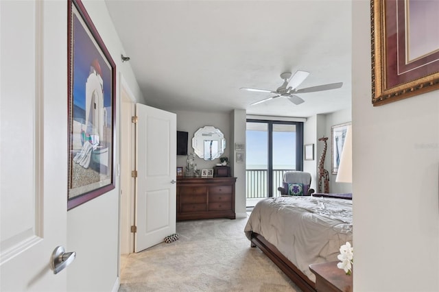 bedroom featuring a ceiling fan, light colored carpet, and access to exterior