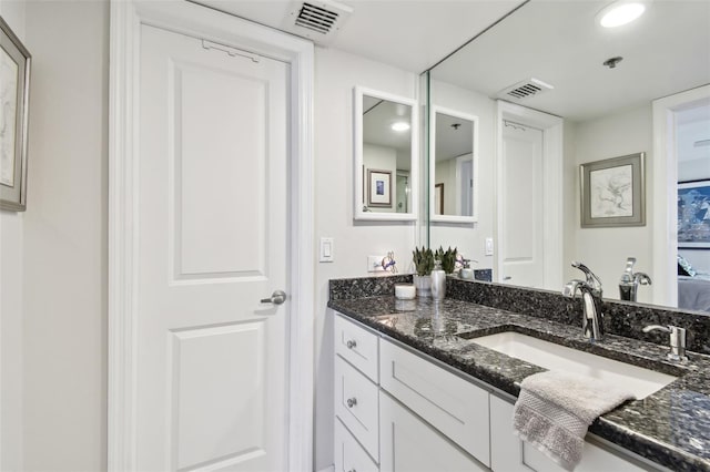 bathroom with visible vents and vanity