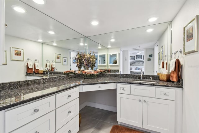 bathroom with ensuite bath, tile patterned flooring, and recessed lighting