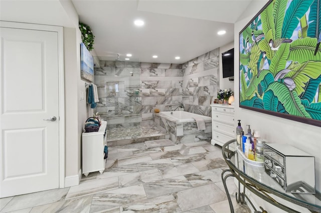 bathroom with marble finish floor, tiled shower, a garden tub, and recessed lighting