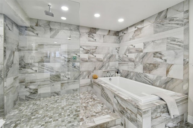 bathroom featuring a tile shower, a garden tub, and recessed lighting