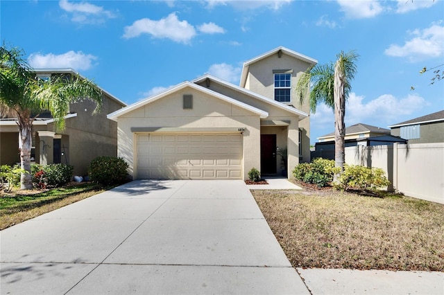 view of front of home with a garage and a front lawn