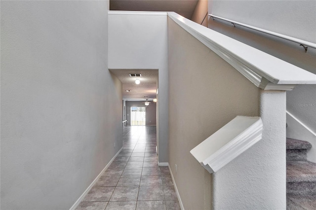 corridor featuring light tile patterned flooring