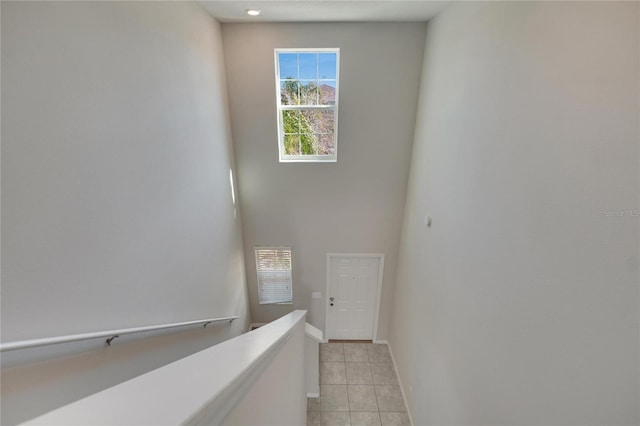 hall with light tile patterned flooring