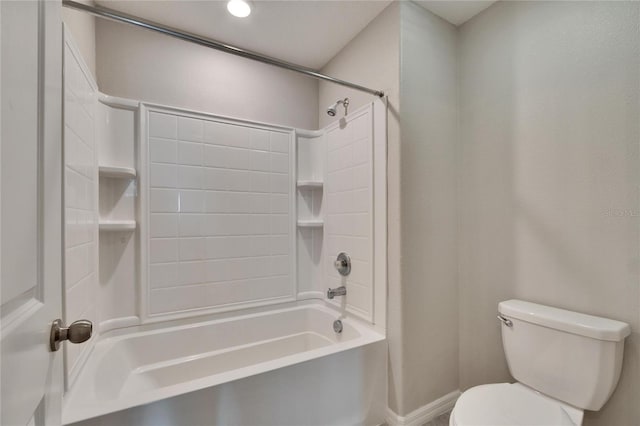 bathroom with bathtub / shower combination and toilet