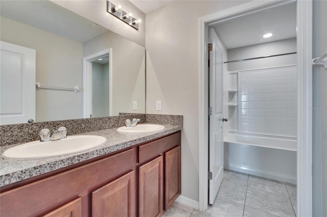 bathroom with tile patterned floors, vanity, and shower / bathing tub combination