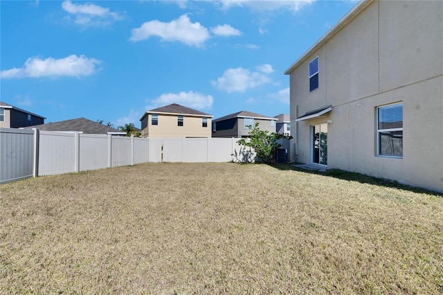 view of yard with a residential view and a fenced backyard