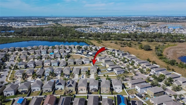 aerial view with a water view and a residential view