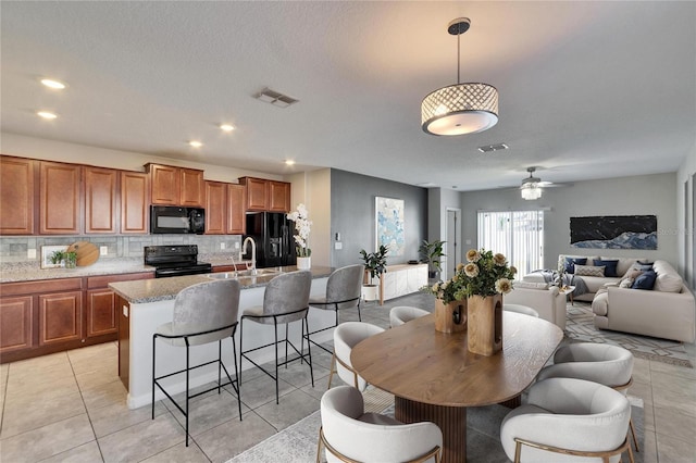 dining space featuring light tile patterned floors, ceiling fan, visible vents, and recessed lighting