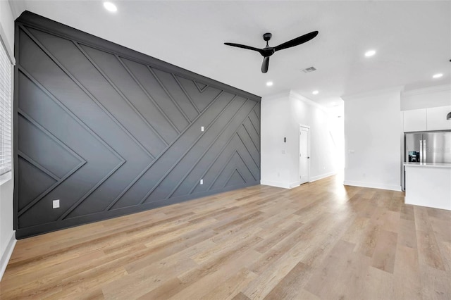 unfurnished living room with ceiling fan, light hardwood / wood-style flooring, and ornamental molding