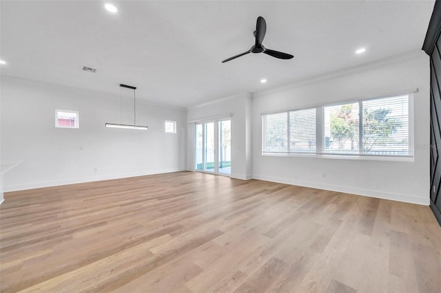 empty room with ceiling fan, crown molding, and light wood-type flooring