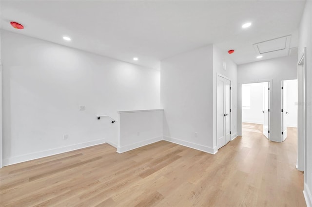 spare room with light wood-type flooring