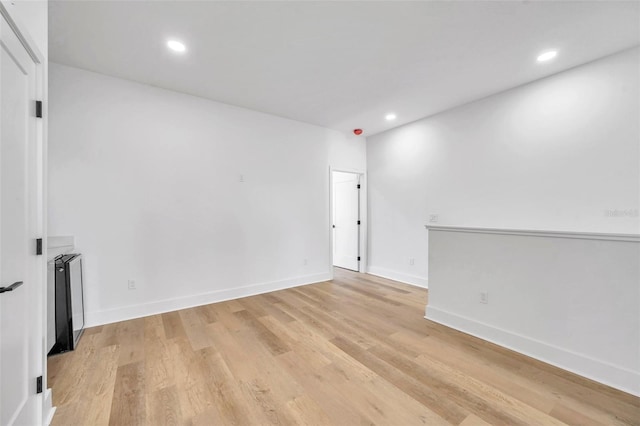 unfurnished room featuring light hardwood / wood-style flooring