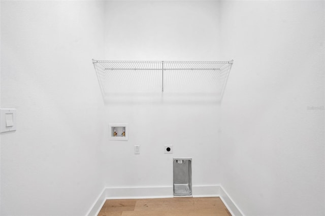 laundry area with washer hookup, wood-type flooring, and electric dryer hookup