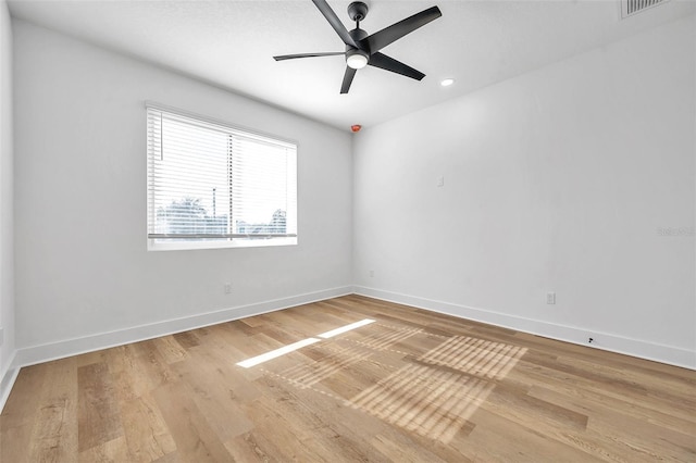 empty room with ceiling fan and wood-type flooring