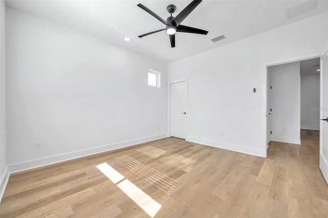 spare room featuring ceiling fan and light wood-type flooring