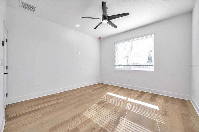 empty room featuring ceiling fan and light hardwood / wood-style floors