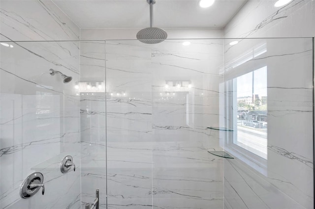 bathroom with a tile shower