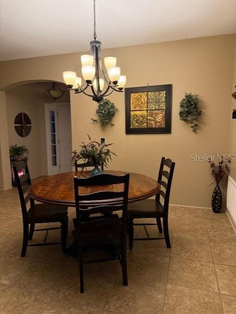 dining space featuring a chandelier