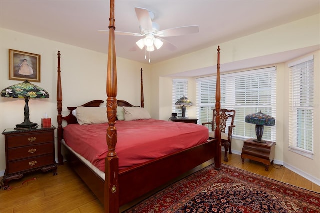 bedroom with ceiling fan and light hardwood / wood-style floors