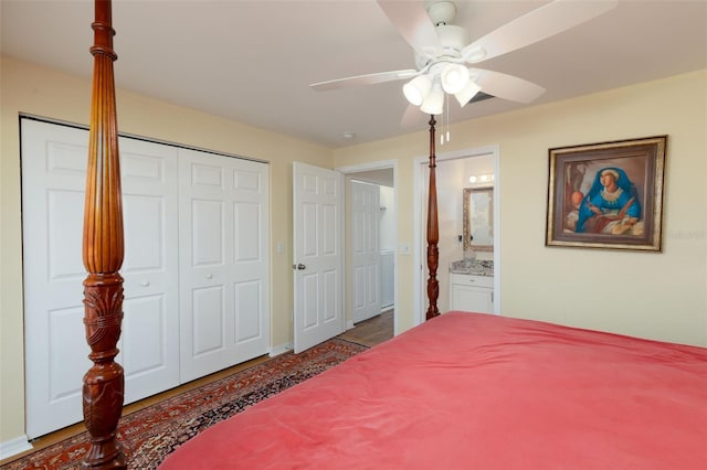 bedroom with ensuite bathroom, ceiling fan, and a closet