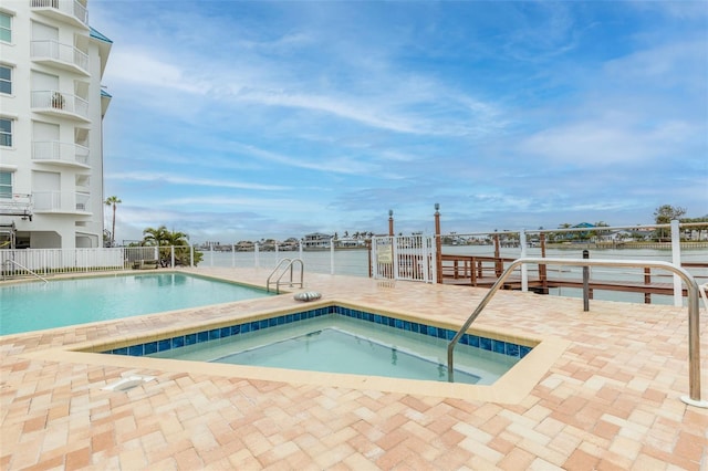 view of pool featuring a water view