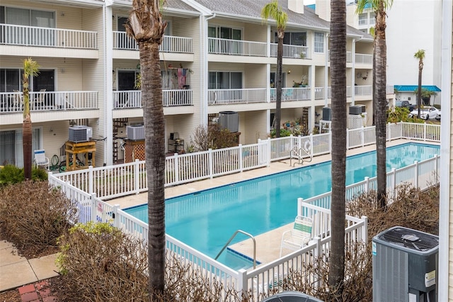 view of pool featuring central AC unit