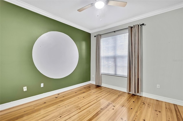 unfurnished room featuring ceiling fan, a wealth of natural light, light hardwood / wood-style flooring, and crown molding