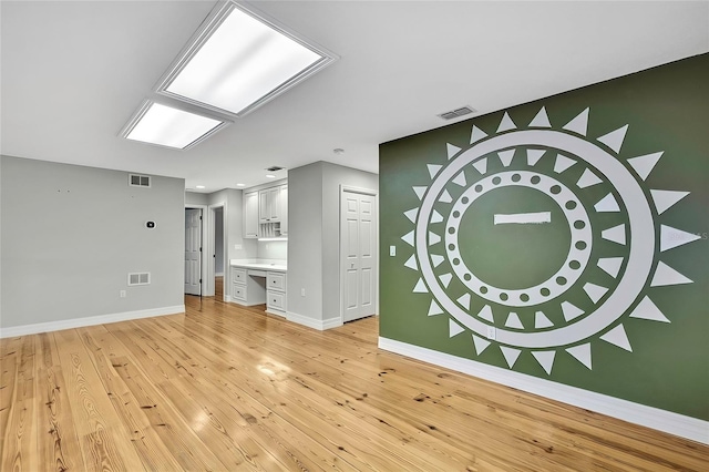 unfurnished living room with light hardwood / wood-style floors