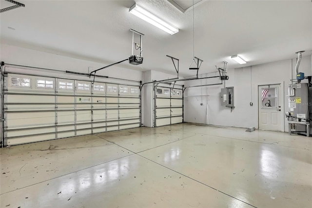 garage featuring water heater, a garage door opener, and electric panel