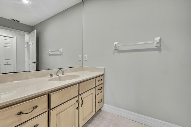 bathroom featuring tile patterned floors and vanity