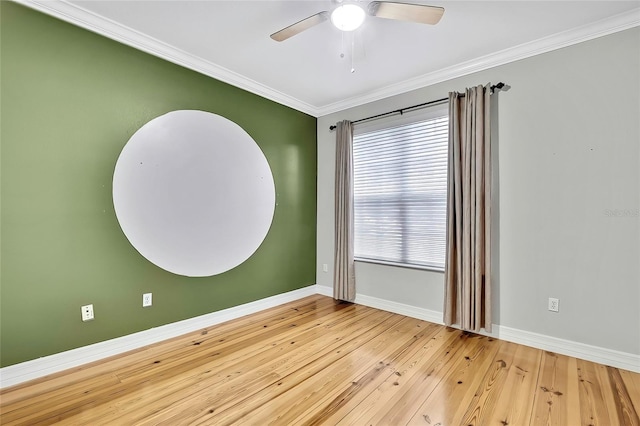 empty room with a healthy amount of sunlight, light hardwood / wood-style flooring, ceiling fan, and ornamental molding