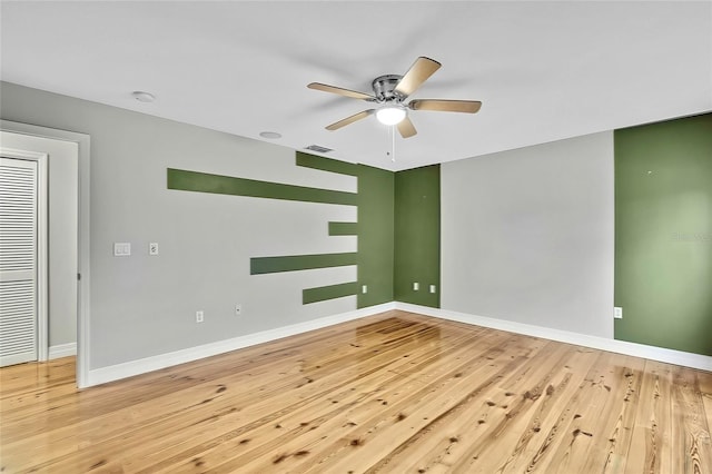 unfurnished room with ceiling fan and light hardwood / wood-style flooring