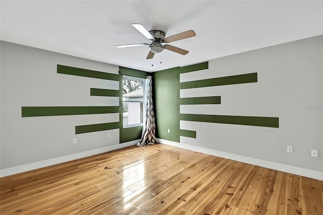 unfurnished room with light wood-type flooring and ceiling fan