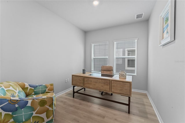 office space with light wood-type flooring