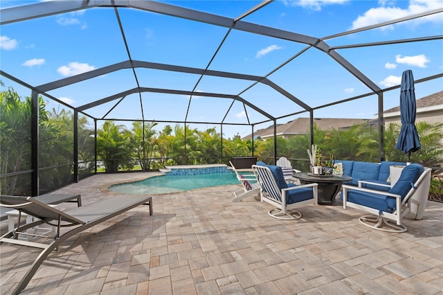 view of swimming pool with glass enclosure, an outdoor living space with a fire pit, pool water feature, and a patio