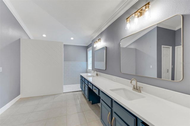 bathroom with vanity, ornamental molding, and tile patterned flooring