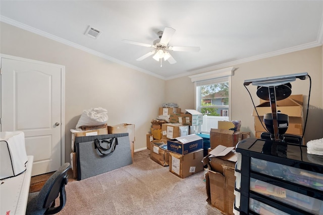 office featuring light carpet, ceiling fan, and ornamental molding