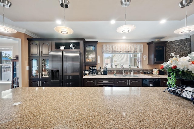 kitchen with decorative light fixtures, sink, stainless steel fridge with ice dispenser, and crown molding