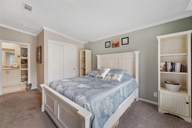 bedroom featuring a closet, ornamental molding, and light colored carpet