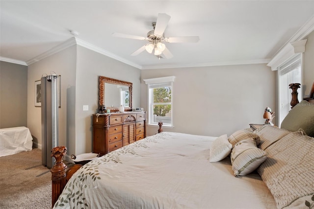 carpeted bedroom with ceiling fan and crown molding